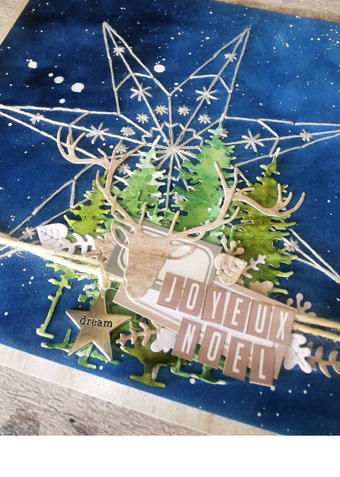 carte de Noël en scrapbooking avec un fond bleu et une étoile brodée